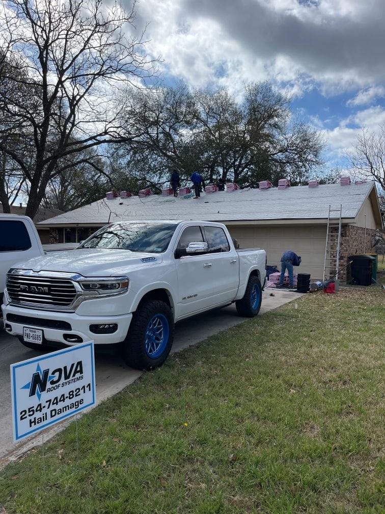 Nova Roofing Sign and Truck With Roof Replacement in Cameron TX